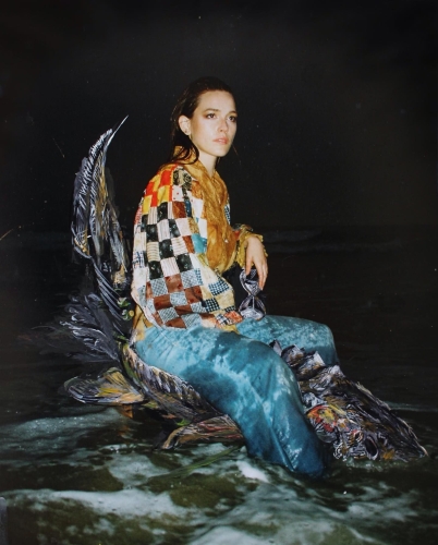 "Sturgeon Rider acrylic paint on inkjet print (35 mm Kodak)".
